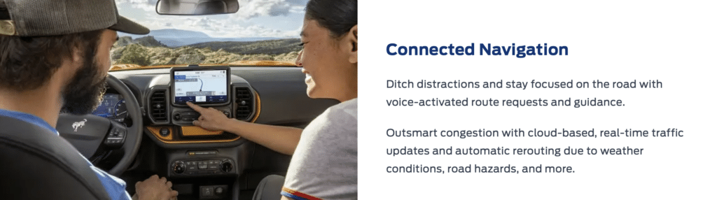 Driving with a navigation system in focus, showing route and features like voice-activated guidance.